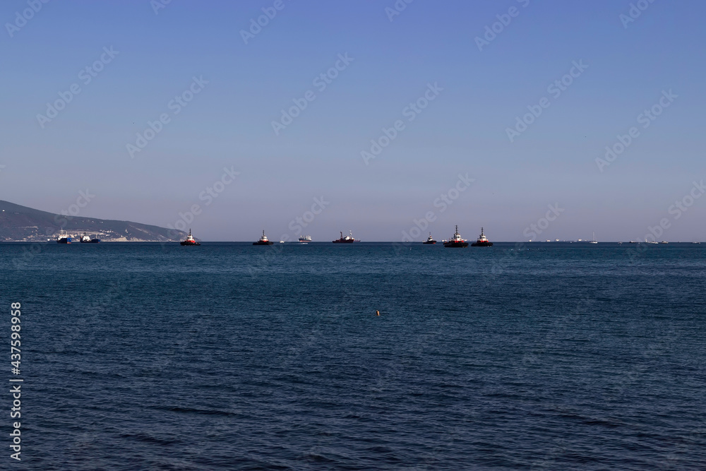 Ships at the entrance to the sea bay in the afternoon.