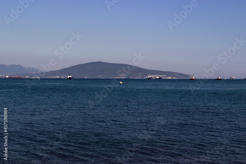 Ships at the entrance to the sea bay in the afternoon.