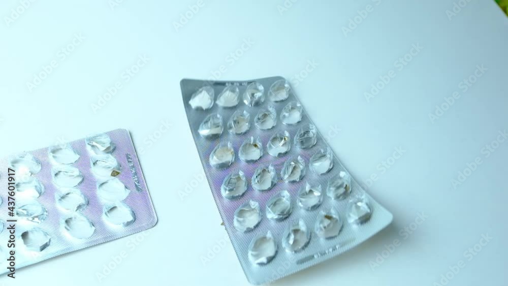 pills, medicine falling on the table from above, bouncing, scattering, slow motion, concept development, production, sale of drugs, pharmaceutical products pills, medicine falling on the table from above, bouncing, scattering, slow motion, concept development, production, sale of drugs, pharmaceutical products