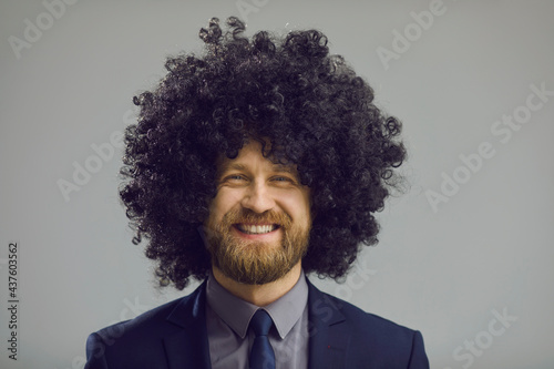 Fotografie, Obraz Headshot of cheerful man with crazy hair smiling at camera