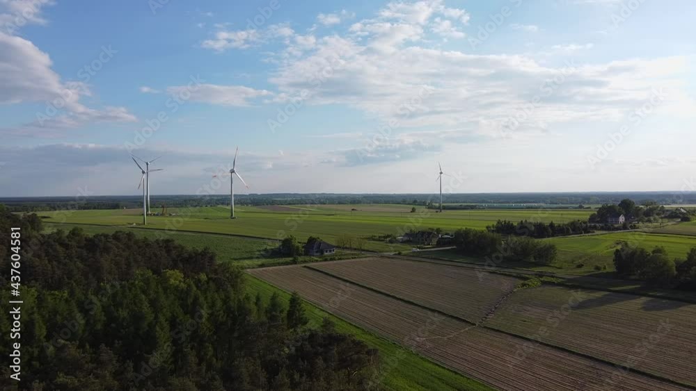 Windmills producing electricity in the fields of central Poland. Windmills producing electricity in the fields of central Poland.