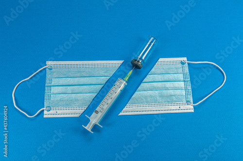 Blue background with surgical mask