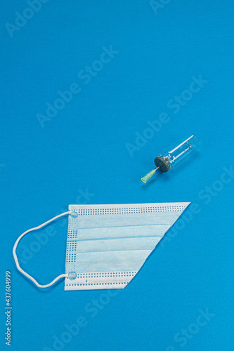 Blue background with surgical mask