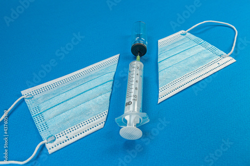 Blue background with surgical mask