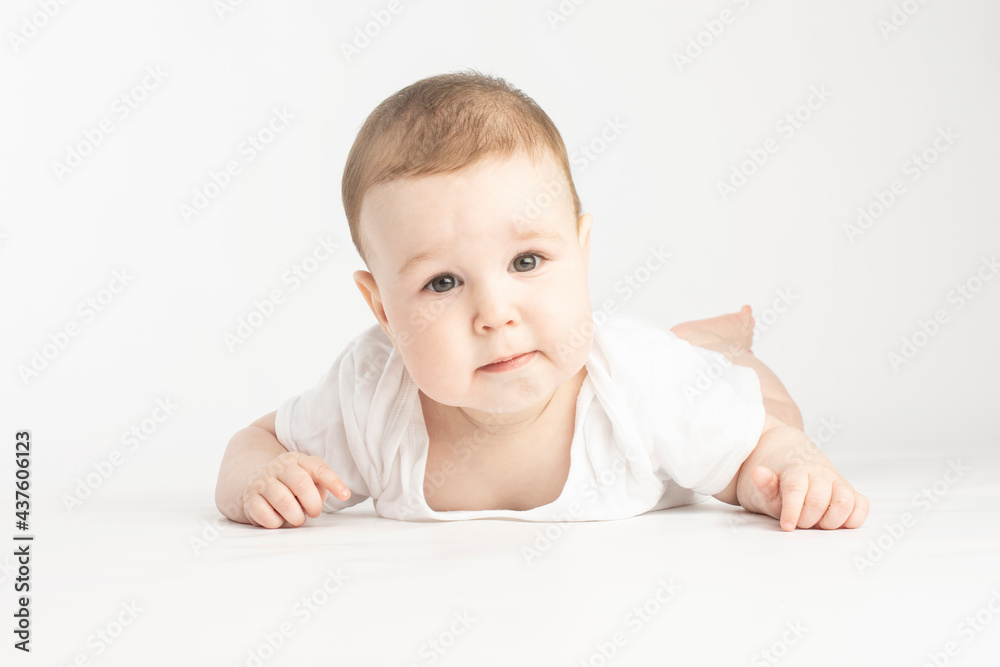 portrait of a baby, face without emotions, look at the camera on a white background portrait of a baby, face without emotions, look at the camera on a white background