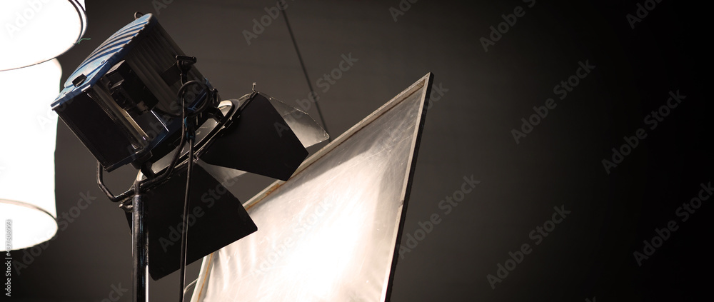 Studio light equipments for photo or film movie video. Light set for  professional shooting and screen background. LED Flood light and Spot light  for video production. Setup include Barn door softbox. Stock