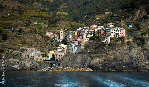 Village of vernazza with colourful houses at the edge of the cliff Riomaggiore, Cinque Terre, Liguria, Italy