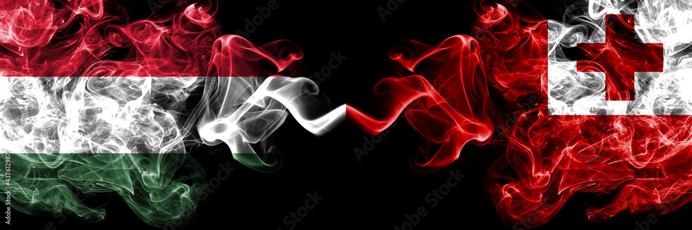 Hungary, Hungarian vs Tonga smoky flags side by side. Hungary, Hungarian vs Tonga smoky flags side by side.