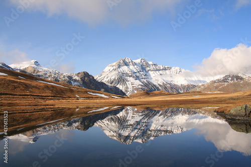 Amazing reflections in lake Plan du Lac Bellecombe looking towards La Grande Casse in the French alps 