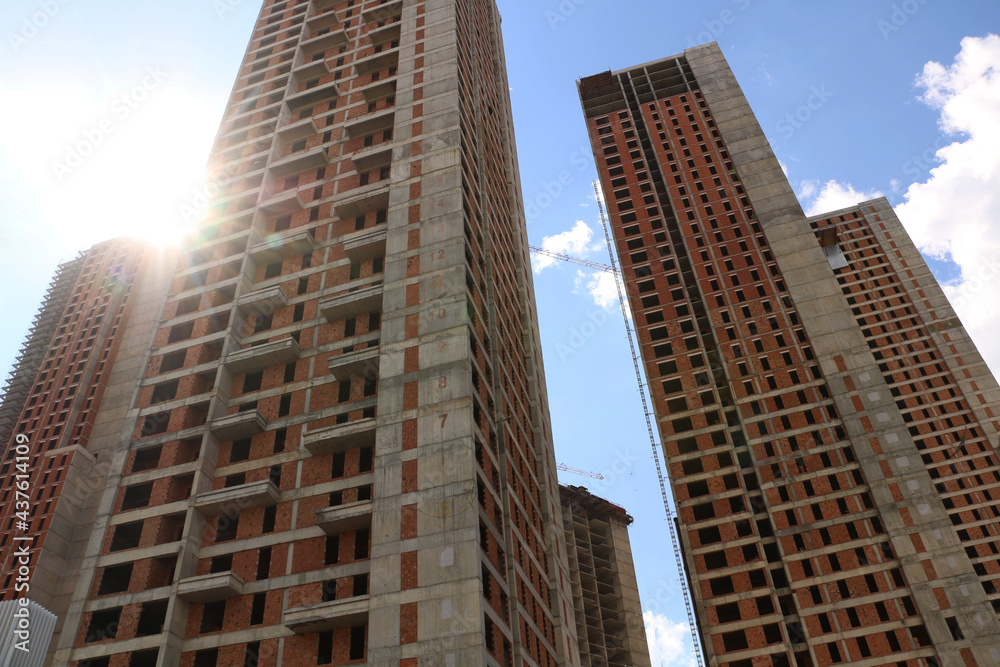selective focus Tall buildings and blue sky. turkey istanbul's new buildings under construction reaching the clouds selective focus Tall buildings and blue sky. turkey istanbul's new buildings under construction reaching the clouds