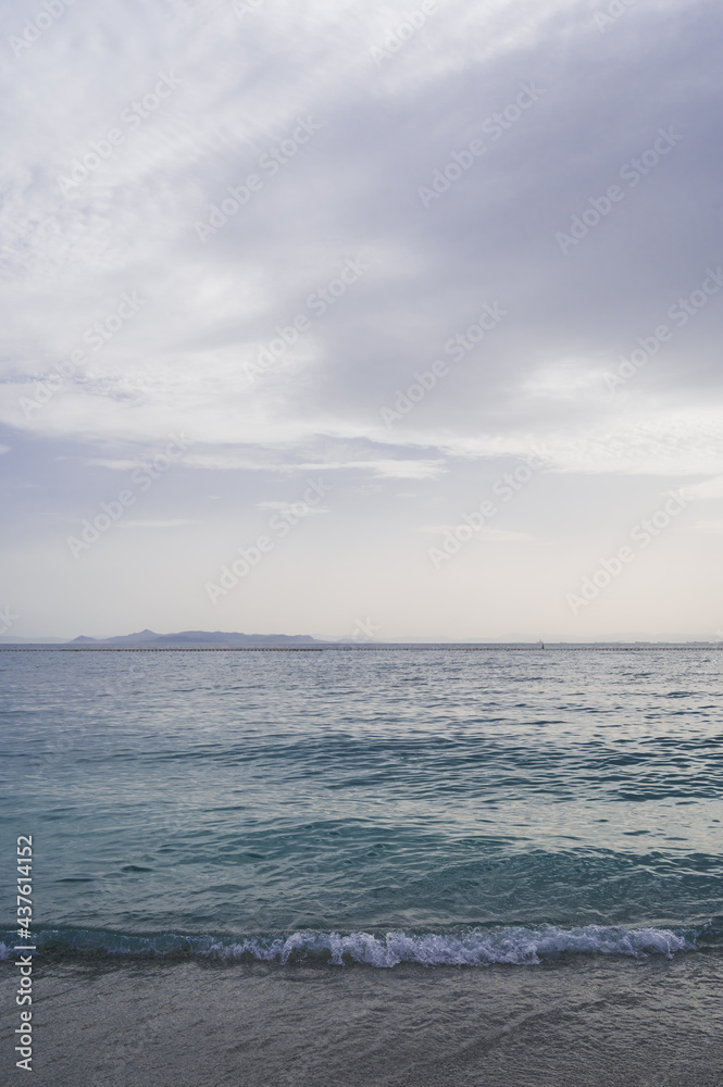 Beautiful landscape of Aegean sea in Athens at cloudy day. Silhouettes of islands in the mist. Nobody. Greece.