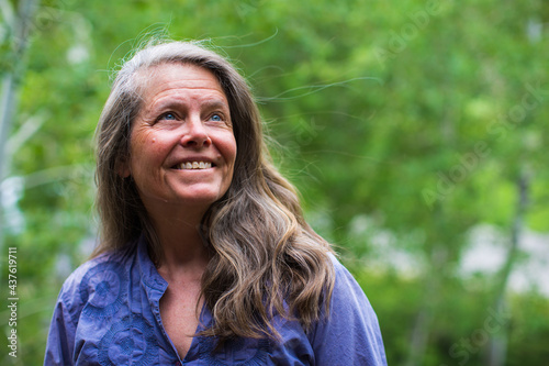 A portrait of a natural beautiful woman outside in nature