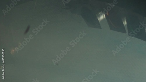 Three classic stage spotlights flash in the fog under the stage ceiling in a loop