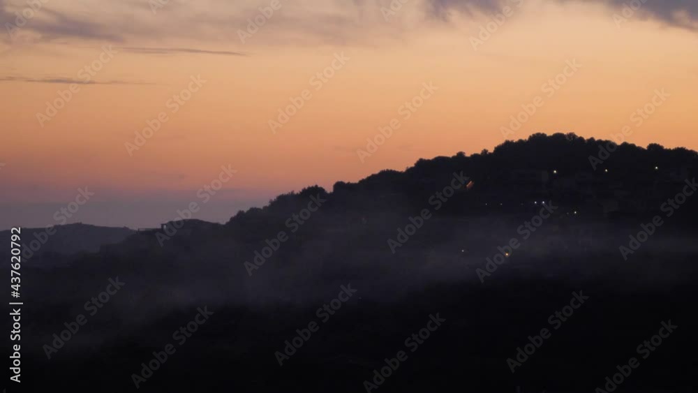 Beautiful soft orange sunset behind hills in Chia, Southern Sardinia, Italy Beautiful soft orange sunset behind hills in Chia, Southern Sardinia, Italy