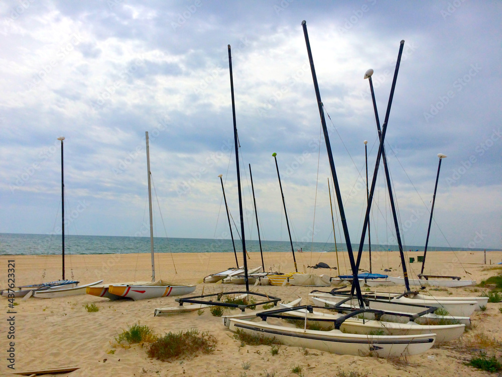 Sport sailboats stranded in the sand on a Winter's day in Rota beach, Cadiz, Andalusia, Spain