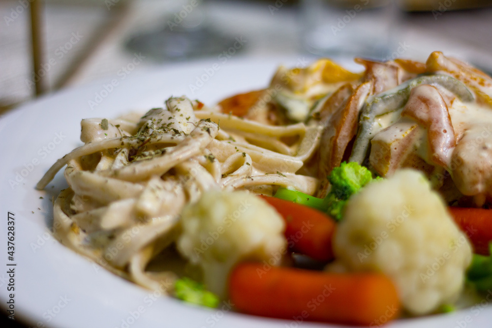 Close up to a fancy dinner plate in a event Close up to a fancy dinner plate in a event