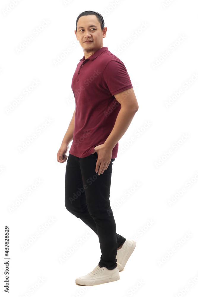 Asian man wearing maroon red shirt black denim and white shoes, walking forward, side view, happy confidence expression. Full body portrait isolated Asian man wearing maroon red shirt black denim and white shoes, walking forward, side view, happy confidence expression. Full body portrait isolated