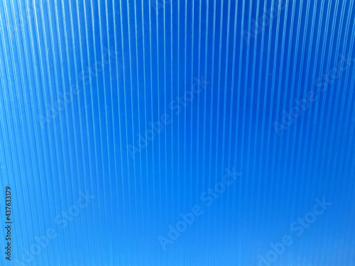 Bright blue background with vertical lines