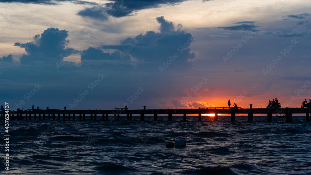 Sunset, Sky, Clouds over sea and silhouette bridge.