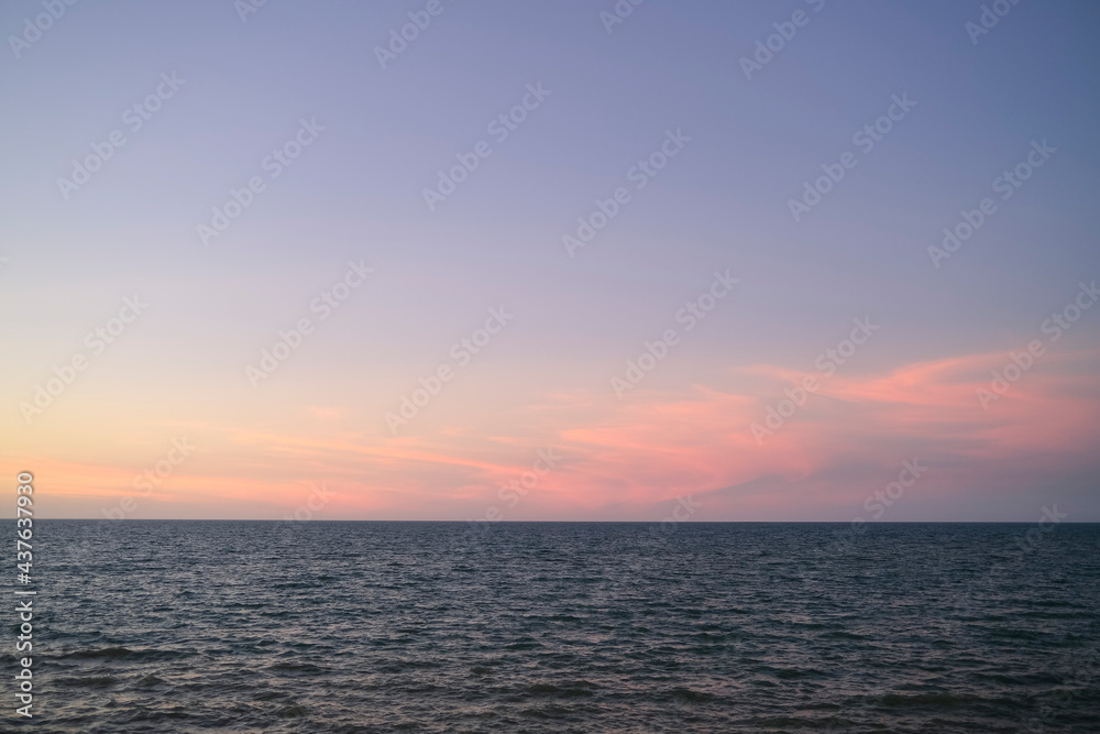 Evening sunset over the ocean, horizon over water