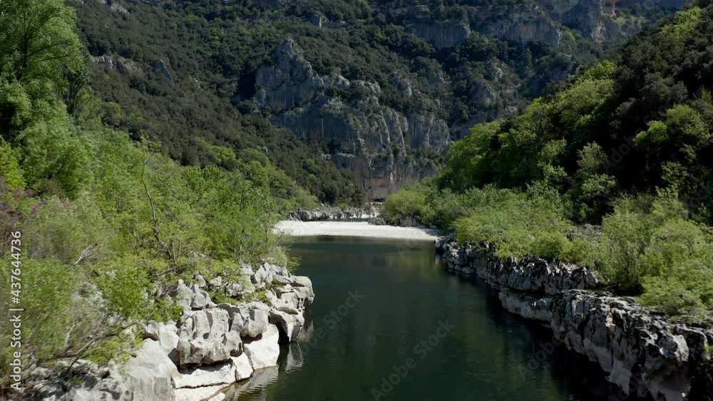 Flying with a drone above a river lost in nature - Ardeche Flying with a drone above a river lost in nature - Ardeche