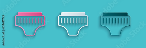 Paper cut Adult diaper icon isolated on blue background. Paper art style. Vector