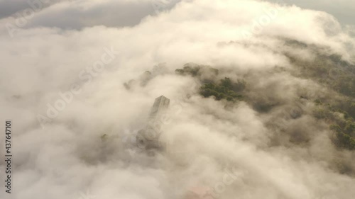 Aerial view over Mount Tavor and Church of the Transfiguration
Drone view from North Israel at sunrise covered with clouds, 2021
 photo