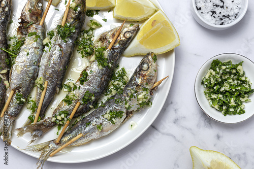 Homemade Grilled Sardines with Garlic, Olive Oil, Fresh Parsley, and Lemon
