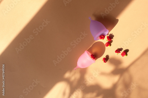 Menstrual cups minimalistic sunny image flat lay top view background with copy space photo