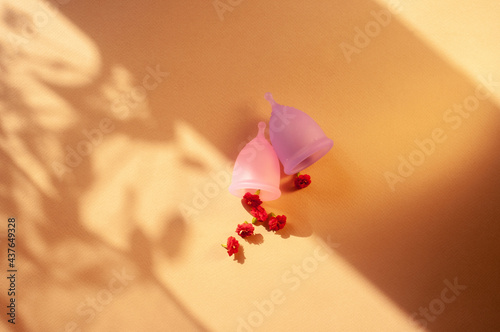 Menstrual cups minimalistic sunny image flat lay top view background with copy space photo