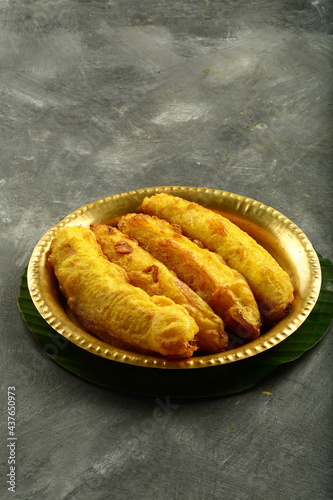 Delicious homemade fried bananas served in copper plate. Kerala foods backgrounds.   photo