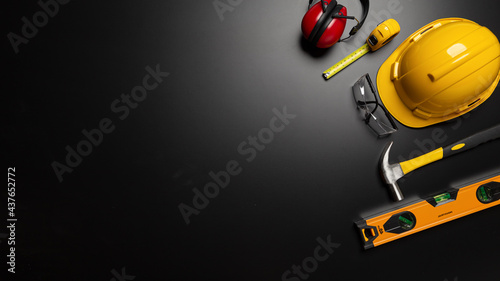 Work safety. Construction site protective equipment on wooden background, flat lay, copy space, top view © A Stockphoto