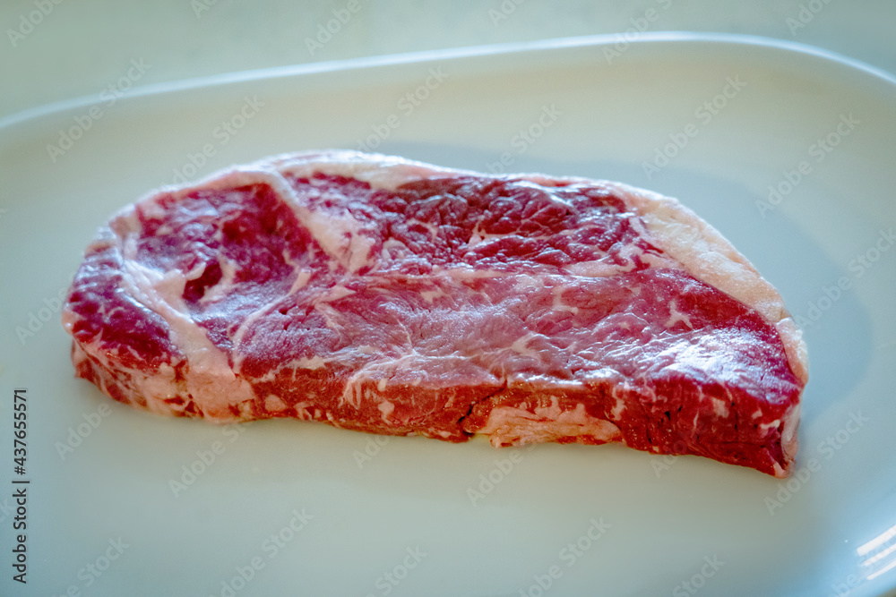 Beef Steak. Organic Red Raw Steak Sirloin in girl hand. Beef Steak. Organic Red Raw Steak Sirloin in girl hand.