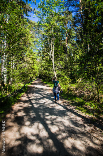 Obraz na płótnie Young women walking in forest. w salonie