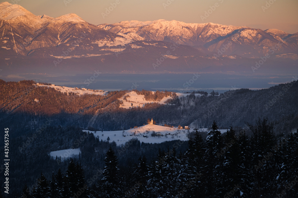 Sv.Tomaz in Winter snow in sunset