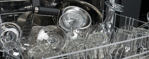 close-up of glass utensils, in the deep compartment of the dishwasher
