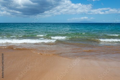 Sea background, nature of tropical summer beach with rays of sun light. Sand beach, sea water with copy space, summer vacation concept.