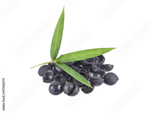 bamboo charcoal macadamia isolated on white background