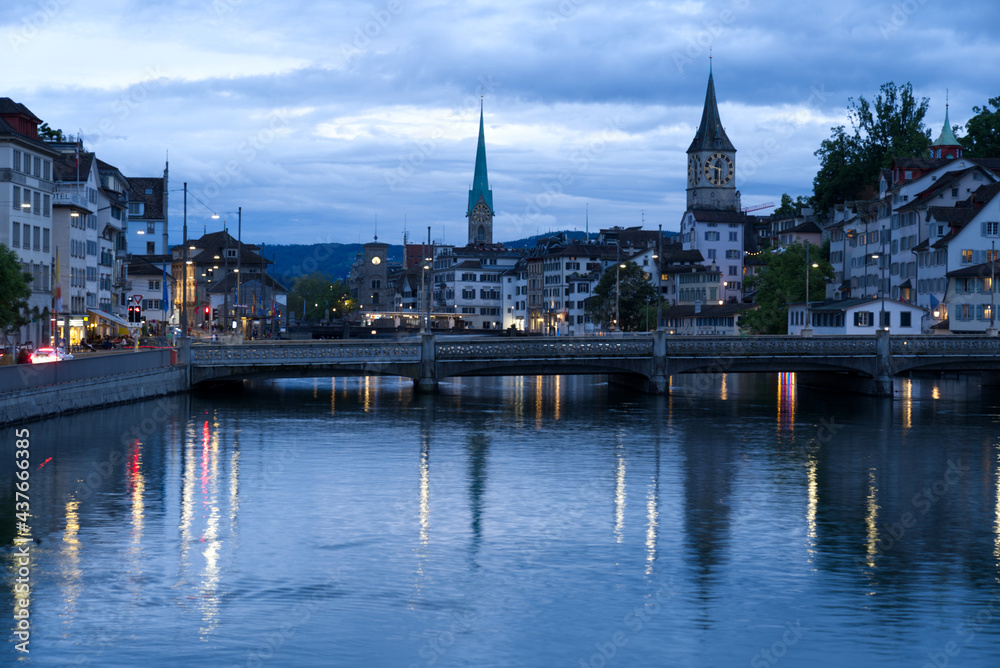 Old town of Zurich with river Limmat and churches St. Peter and Fraumünster (Women's minster) at Saturday night at summertime. Photo taken June 5th, 2021, Zurich, Switzerland. Old town of Zurich with river Limmat and churches St. Peter and Fraumünster (Women's minster) at Saturday night at summertime. Photo taken June 5th, 2021, Zurich, Switzerland.