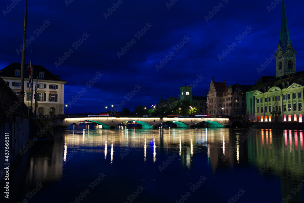 Münsterbrücke (Minster Bridge) at the old town of Zurich by night at summertime. Photo taken June 5th, 2021, Zurich, Switzerland.