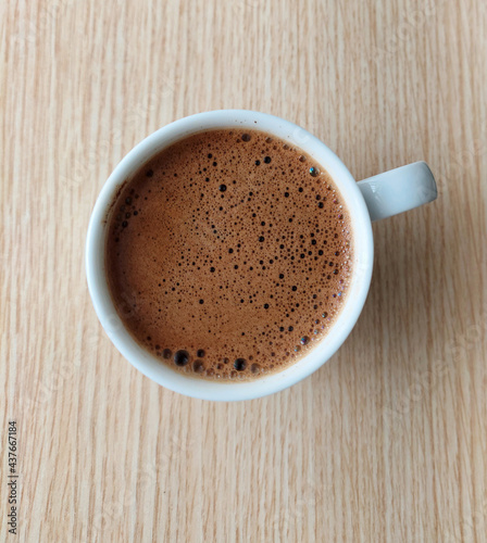 cup of coffee on a wooden table