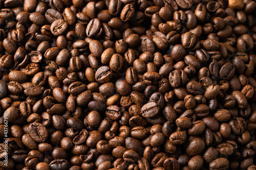 Roasted coffee beans texture background. Close up of detail © vasanty