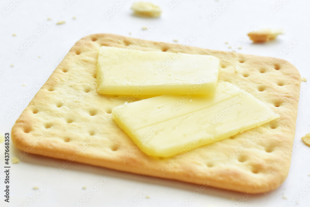 Crackers and cheese on white background.  Healthy and dietary food. 