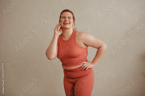 Konstfotografi Confident plus size woman in sports clothing