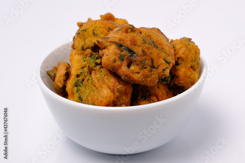 Indian snack pakora in white ceramic bowl