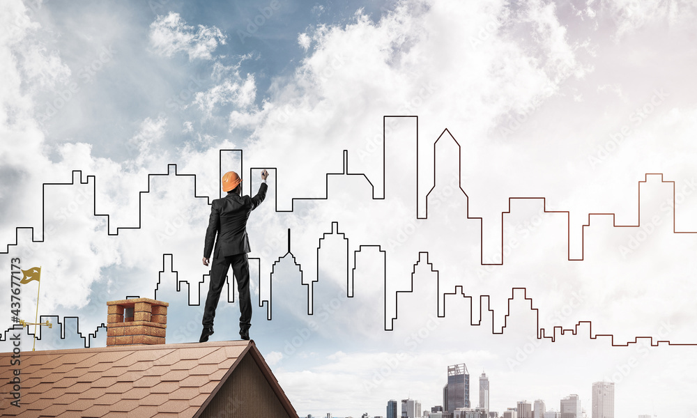 Man architect draw silhouette of modern city on blue sky. Mixed Man architect draw silhouette of modern city on blue sky. Mixed