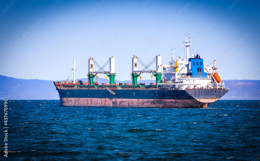 selective focus bulk cargo ship to harbor quayside Vladivostok