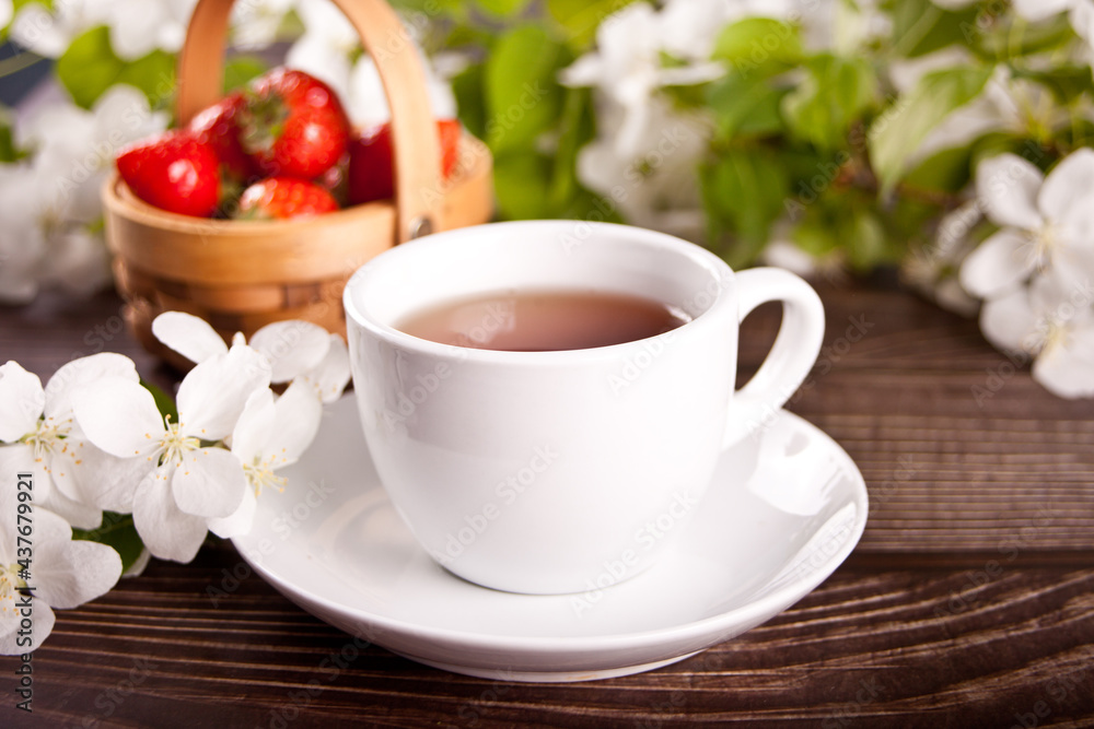 Cup of tea with white apple blossoms. Spring concept. Cup of tea with white apple blossoms. Spring concept.