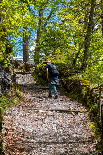 woman hiking toward Braundwald in Glarus, Switzerland