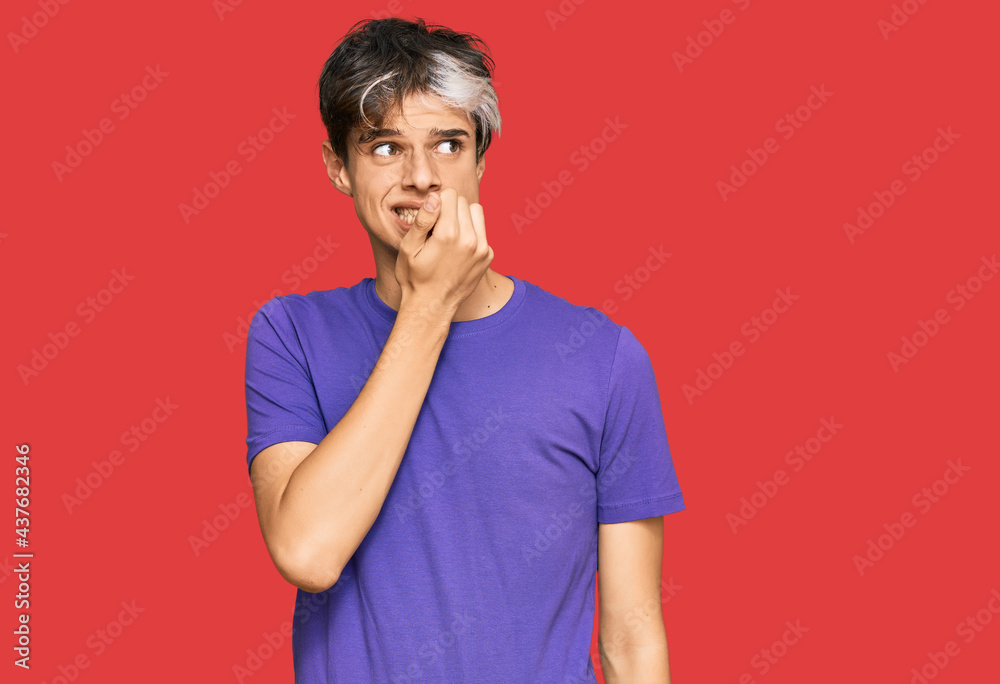 Young hispanic man wearing casual clothes looking stressed and nervous with hands on mouth biting nails. anxiety problem. Young hispanic man wearing casual clothes looking stressed and nervous with hands on mouth biting nails. anxiety problem.